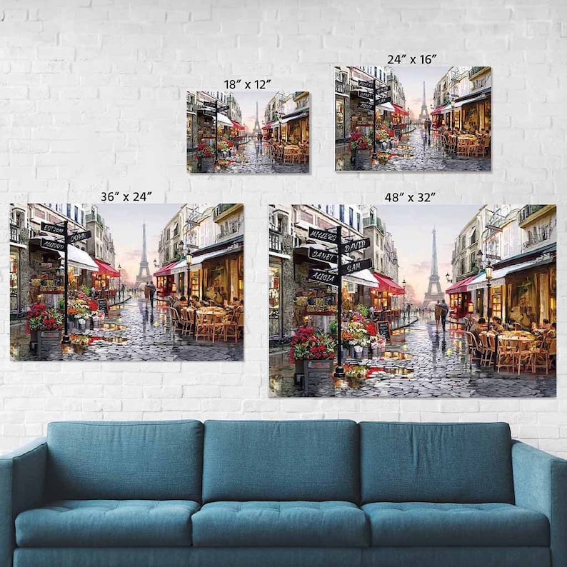 May include: A painting of a Parisian street scene with the Eiffel Tower in the background. The street is lined with shops and cafes, and there are people walking and sitting outside. The painting is in a variety of colors, including red, white, blue, and green.