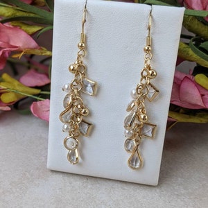 Gold Plated Dangle Earrings with Baubles, Pearls, and Glass Charms