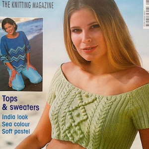 May include: A Sandra knitting magazine cover featuring a light green, off-the-shoulder, short-sleeved knit crop top with a central cable and bobble pattern. The cover includes the text Sandra, The Knitting Magazine, and The most splendid for the summer.