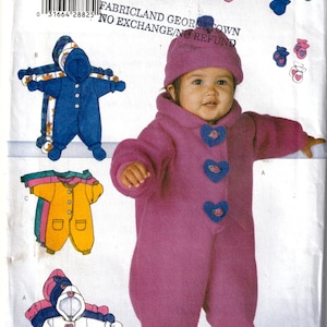 May include: A sewing pattern for a baby's one-piece outfit with a hood. The pattern includes instructions for making a pink fleece jumpsuit with heart-shaped buttons, a blue jumpsuit with a hood, and a white jumpsuit with a hood. The pattern also includes instructions for making matching mittens.