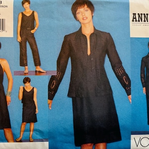 May include: Vogue pattern 2553 by Anna Sui, featuring a variety of women's clothing designs. The image showcases a dark navy blue halter dress, a jumpsuit, a skirt suit, and a dress with a matching jacket. The pattern size is 12-14-16.