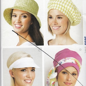 May include: A Kwik Sew pattern showing four hat designs: a wide-brimmed hat, a beret, a visor, and a turban. The pattern number is 3699, with sizes S-M-L. The image includes the text "HATS" and "BY KERSTIN MARTENSSON."