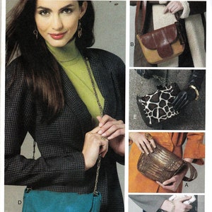 May include: A pattern for making different styles of handbags. The pattern includes a blue, a brown, a black and white, a gold, and a blue and black handbag.