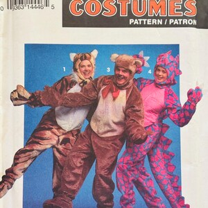 May include: A Simplicity Costumes sewing pattern envelope, number 8583, size A (SM-LG). The front features illustrations of three full-body animal costumes: a tiger, a brown bear with a red neck bow, and a pink and blue patterned dragon.