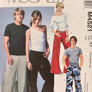 May include: McCall's M4521 sewing pattern envelope featuring illustrations of various clothing styles. The designs include cargo trousers in light grey and blue camouflage, a black t-shirt, a white one-shoulder top, and a long-sleeved white shirt.