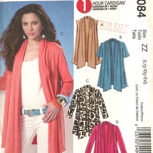 Könnte beinhalten: McCall's M6084 Schnittmuster für eine 1-Stunden-Strickjacke. Die Hülle zeigt eine korallenrote Strickjacke, eine beige ärmellose Weste, eine blaugrüne Strickjacke mit kurzen Ärmeln, eine Leopardenmuster-Strickjacke und eine magentafarbene Strickjacke. Größe ZZ (Lrg-Xlg-Xxl).