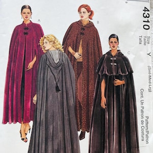 May include: McCall's sewing pattern 4310 for capes in sizes S-M-L. The envelope features illustrations of four cape variations: a long magenta cape, a long brown hooded cape, a long grey hooded cape with a tassel, and a shorter dark brown cape.