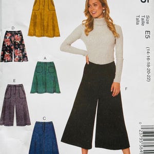 May include: McCall's M7475 sewing pattern featuring various skirt and pants designs. The pattern includes options for different styles, such as a denim skirt, floral print skirt, and wide-leg pants. The size is E5, which fits sizes 14-22.