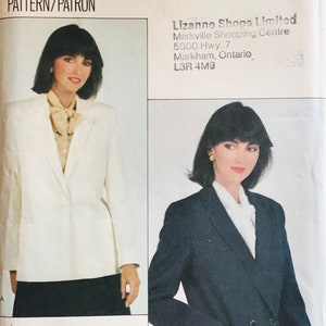 May include: Vogue Patterns sewing pattern featuring a white and navy blazer design. The pattern includes a size 14. The image shows a woman wearing the blazers. The Vogue logo is at the top.