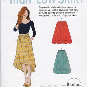 May include: A sewing pattern for a high-low skirt. The image shows a woman wearing a yellow floral skirt with a black top. Two skirt illustrations are shown in red and teal. Text reads "HIGH-LOW SKIRT" and "Sizes XS-XL".