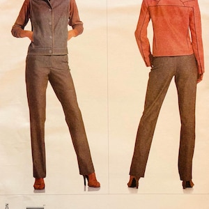 May include: A Marc Jacobs Vogue pattern for a women's suit, featuring a jacket and trousers. The jacket has a collar and buttons, while the trousers are straight-legged. The suit is displayed in a brown tweed material. Measurements are in cm.