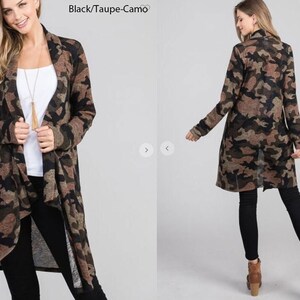 Front and back views of a blonde model wearing a brown and taupe camouflage long cardigan over a white shirt and black pants, labeled black taupe camo.