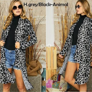 Two views of a blonde model in a heather grey and black animal print cardigan, black shirt, and denim shorts, labeled h grey black animal.