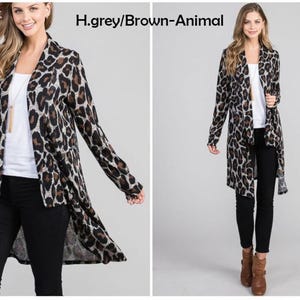 Front and full-body views of a blonde model wearing a grey animal print cardigan over a white top and black pants, labeled h grey brown animal.