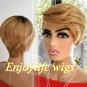 May include: A short, blonde wig with a side part and choppy layers. The wig is styled in a pixie cut with a slightly longer side bang. The wig is worn by a mannequin with a red shirt and silver necklaces. The text "Enjoylife wigs" is visible in the image.