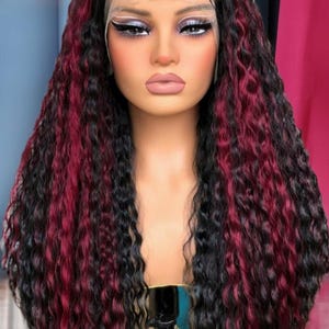 loose wavy big density curly black hd lace front wig with burgundy highlights.