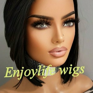 May include: A woman with black hair wearing a silver choker necklace. The text "Enjoylife wigs" is visible in the image.