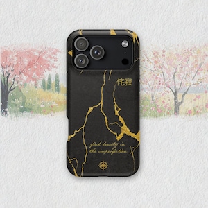 May include: Black phone case with gold-colored vein-like accents and the text "find beauty in the imperfection." The case also features Japanese characters and a compass rose design. The case has a camera module.