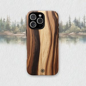 May include: A white ceramic mug with a black handle and the text "But First, Coffee" in a black, handwritten-style font. The mug is on a white surface.