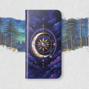 May include: A rectangular phone case featuring a dark blue and purple night sky with clouds, a central golden sunburst, and a crescent moon. The design includes intricate circular geometric lines and small star accents against a deep celestial background.