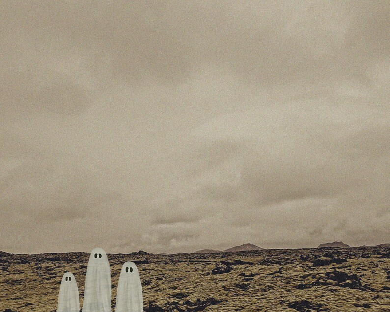 May include: Three white ghosts standing in a field of brown and green moss. The sky is a light gray with a few clouds.