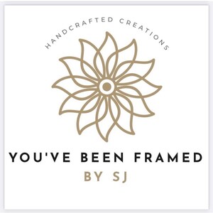 May include: Logo for a business called "You've Been Framed by SJ", featuring a stylized flower design with the text "Handcrafted Creations" in a circle around it.