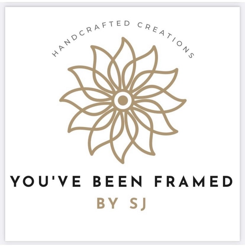 May include: Logo for a business called "You've Been Framed by SJ", featuring a stylized flower design with the text "Handcrafted Creations" in a circle around it.