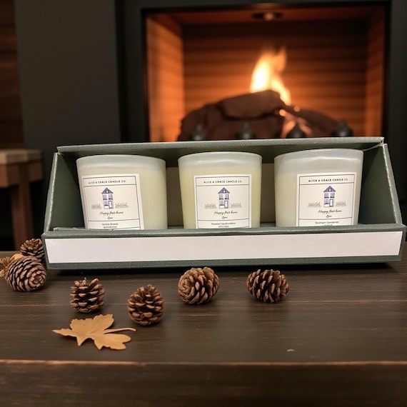 New Home trio of mixed, scented candles, in 20cl white glass containers.