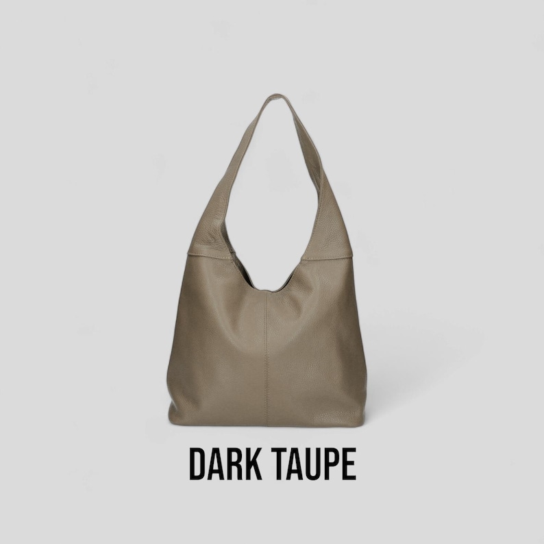 May include: A dark taupe leather tote bag with a slouchy, unstructured design.