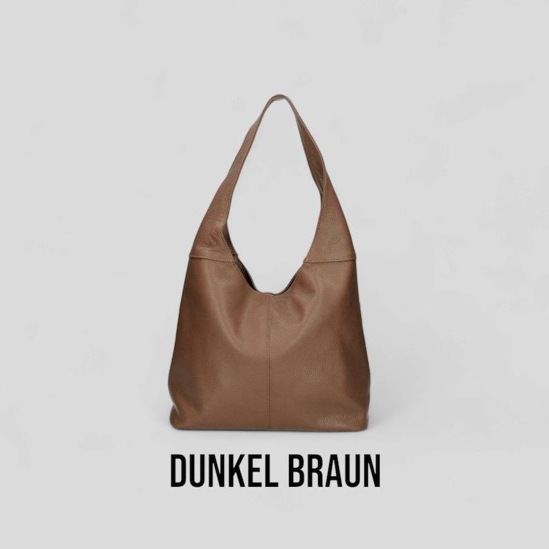 May include: A brown leather hobo bag with a single strap. The bag is on a white background and the text "Dunkel Braun" is below the bag.