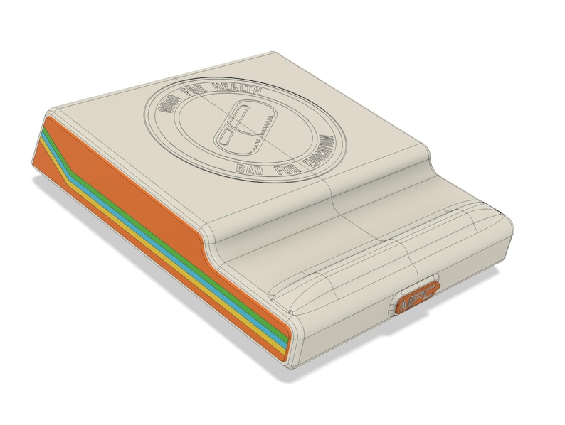 May include: A beige, rectangular device with a curved top and a colorful side panel. The side panel features orange, green, blue, and yellow stripes. The top has a circular design with the text "GOOD FOR HEALTH" and "BAD FOR EDUCATION".