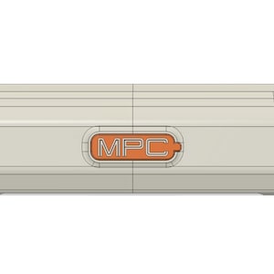 May include: A light beige rectangular device with rounded edges. An orange-colored rectangle is centered on the device, with the letters "MPC" in white. The device has a geometric design with visible lines.