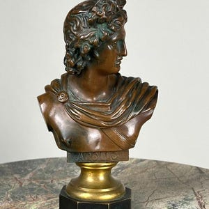 May include: A set of three ceramic mugs with a speckled, matte finish. The mugs are in shades of cream, light gray, and dark gray. Each mug has a simple, minimalist design, perfect for coffee or tea.