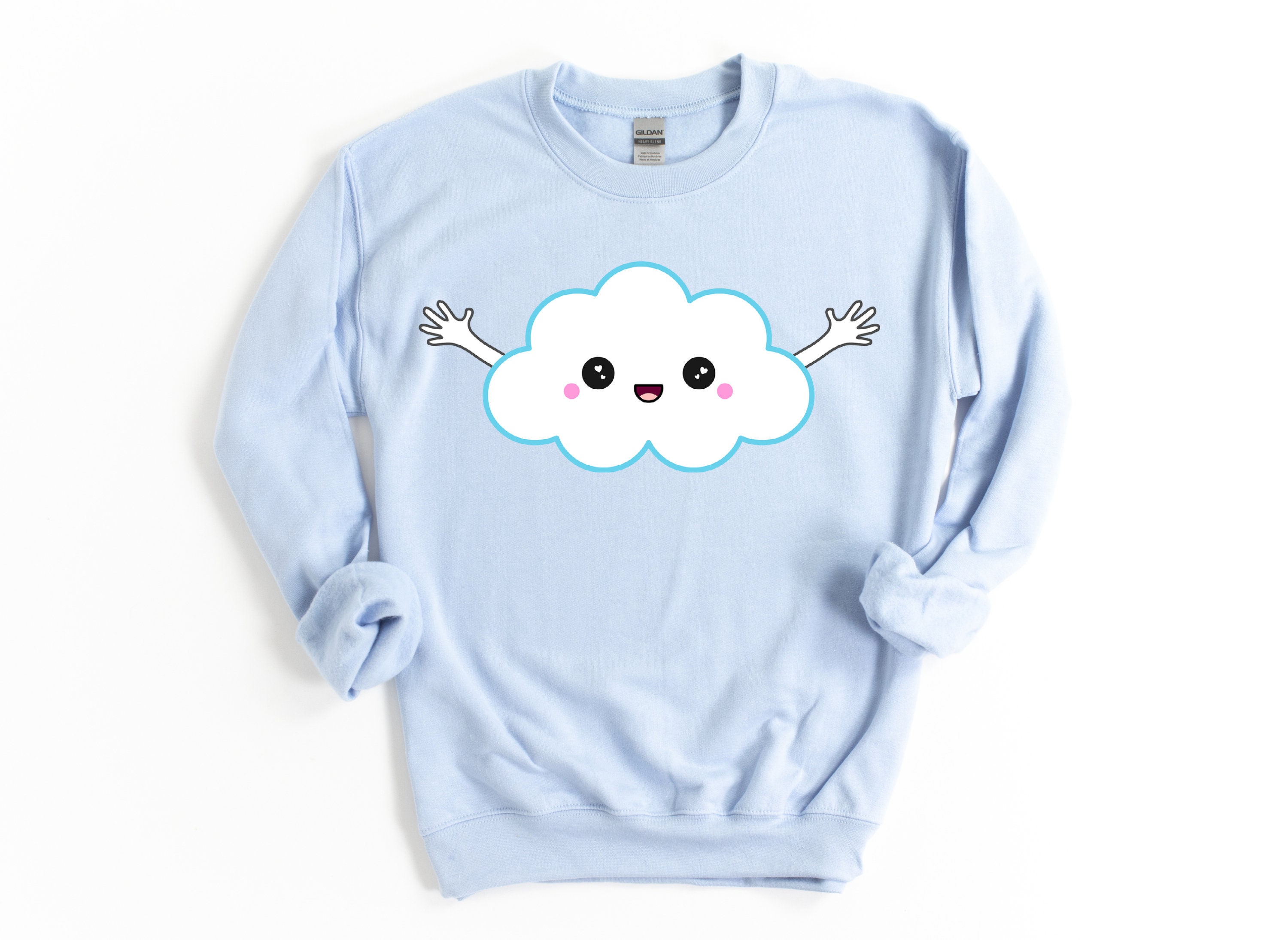 light blue sweater with clouds