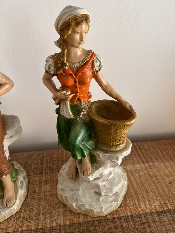 1975 Universal Statuary Corp. Man and Woman Holding Baskets Set of