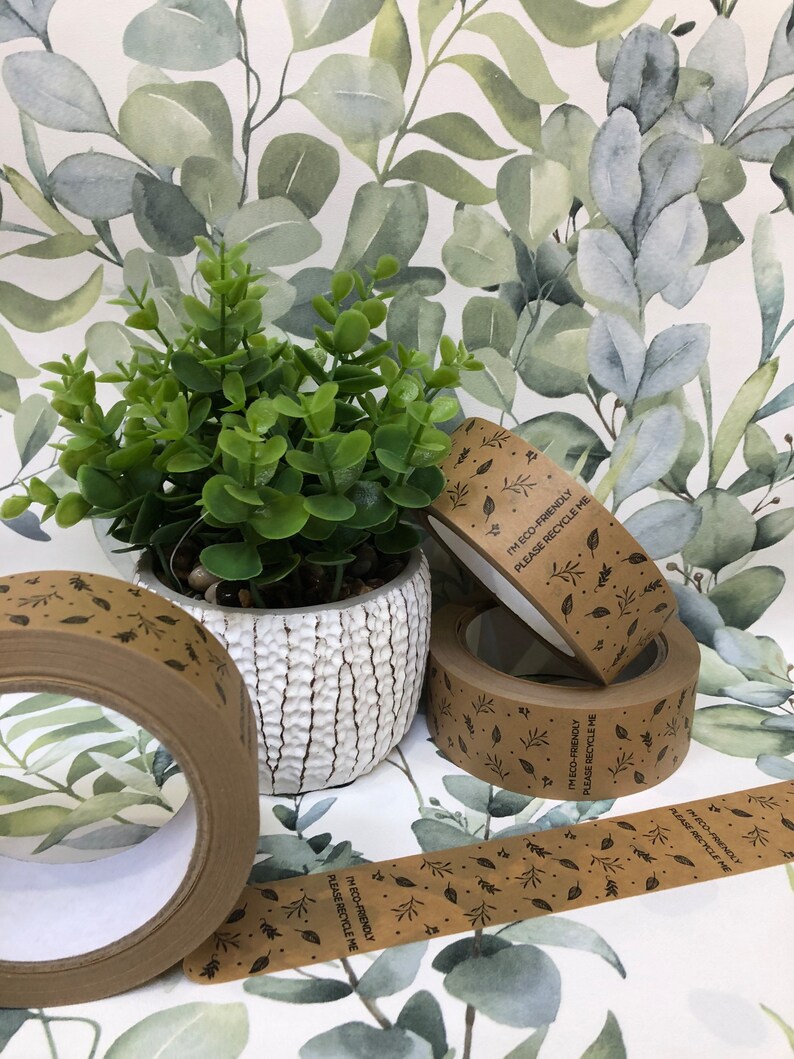 May include: Four rolls of brown paper tape with a leaf pattern and the text "I'm eco-friendly, please recycle me".