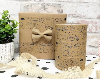 May include: Brown paper gift wrap with a black and white design featuring the text "Happy Mail" and various illustrations. The design includes a hot air balloon, mailboxes, envelopes, and the words "Special Delivery".