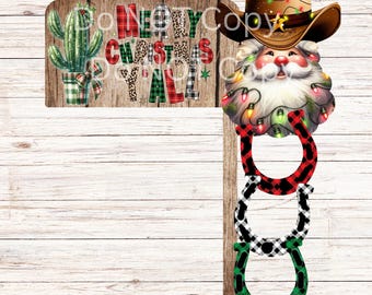 May include: A wooden sign featuring a green cactus in a plaid pot and the text Merry Christmas Y'all. Attached is a Santa Claus head wearing a cowboy hat with string lights, and three stacked horseshoes in red, black, and green plaid patterns.