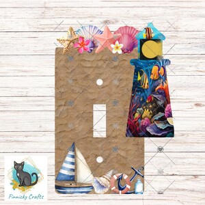 May include: A decorative light switch cover featuring a nautical theme. The design includes a lighthouse with colorful fish, a sailboat, seashells, and a starfish. The cover has a sandy texture and is adorned with various sea elements.