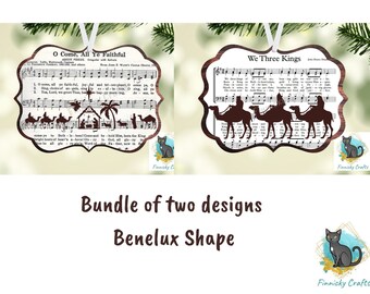 May include: A bundle of two Benelux-shaped ornaments featuring sheet music and silhouettes. One ornament displays O Come, All Ye Faithful with a nativity scene, while the other shows We Three Kings with three figures riding camels.