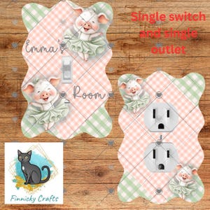 May include: Decorative light switch and outlet covers featuring a pink and green plaid pattern. The covers are adorned with illustrations of smiling pigs in tutus. The text "Emma's Room" is visible on the switch cover. The text "Single switch and single outlet" is also visible.