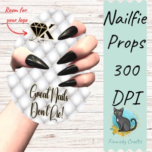 May include: A hand model with long, black stiletto nails holding a white and gold round prop with the text "Great Nails Don't Die!" and a diamond logo. The background is a woodgrain pattern. The text "Nailfie Props 300 DPI" is in the upper right corner of the image. A cartoon black cat is in the lower right corner of the image with the text "Finnicky Crafts".
