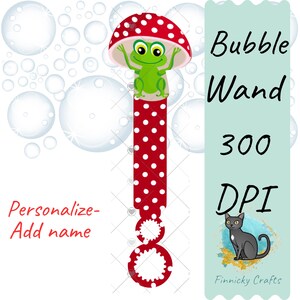 May include: Red and white polka dot bubble wand with a green frog sitting on top of a red mushroom. The wand has a loop at the bottom. The text "Bubble Wand 300 DPI" is on the right side of the image. A black cat is in the lower right corner of the image.