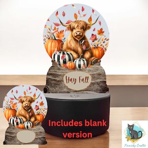 May include: A digital download of a sublimation design featuring a Highland cow surrounded by pumpkins and fall leaves. The design says "Hay Fall" and includes a blank version.