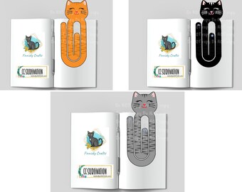May include: Three cat-shaped paper clips in orange tabby, black, and gray tabby patterns. Each clip features a smiling cat face at the top and a long, curved body. The clips are displayed on open books with logos reading Finnicky Crafts and CC SUBLIMATION.
