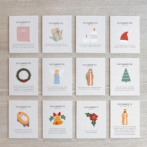 May include: Twelve illustrated cards for December, each with a different image and text. The cards feature a Bible, gifts, candles, a Santa hat, a wreath, an angel, a figure in a robe, a Christmas tree, a baby, a bell, a poinsettia, and a figure in a robe.