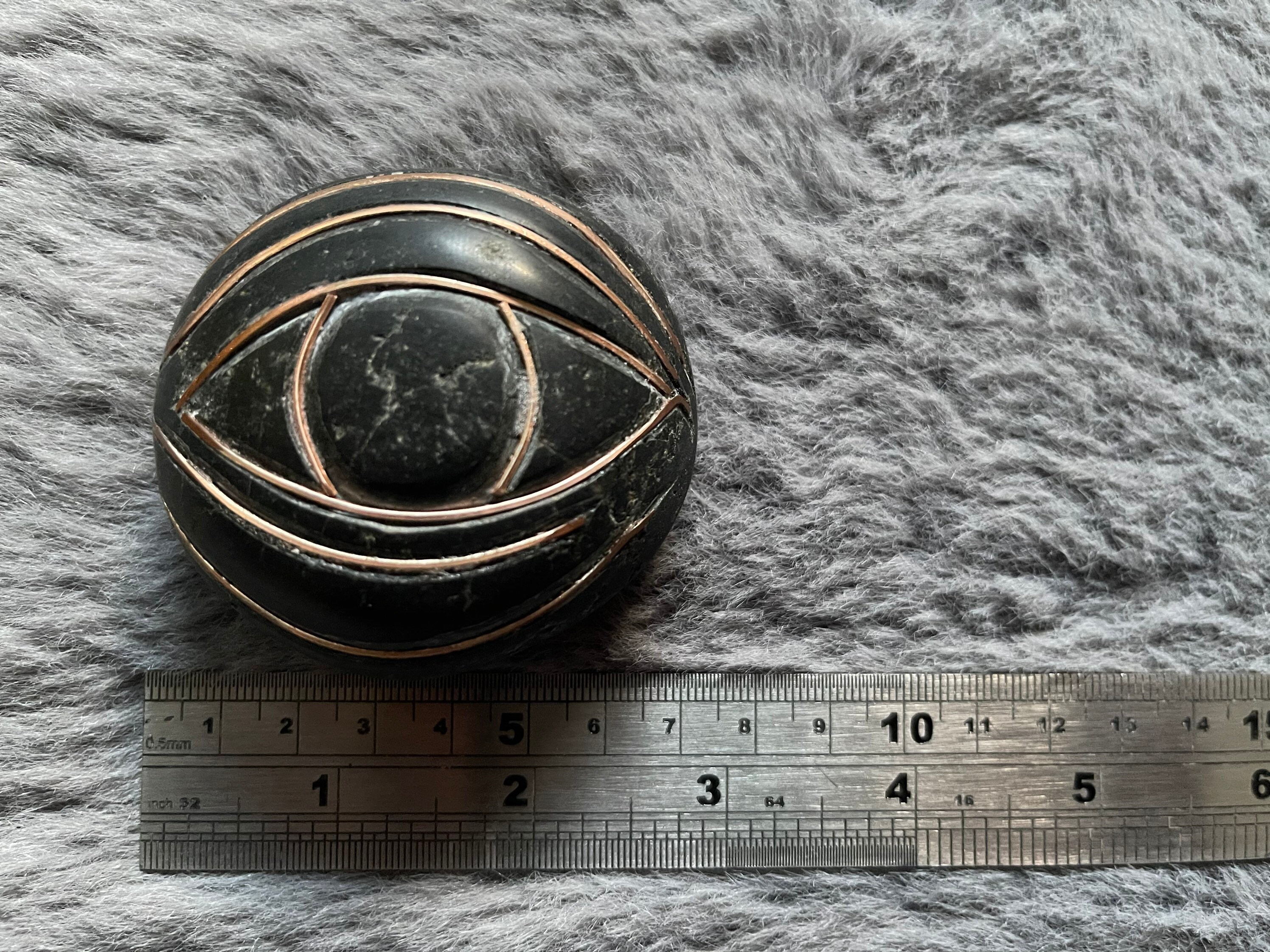 Hand carved and polished stone with eye design. Ideal as Etsy