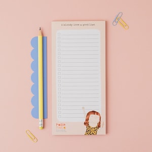 May include: A notepad with the text "I bloody love a good list" and lined pages. A yellow pencil and blue ruler are on the left. A cartoon illustration of a person is at the bottom right. Two paper clips are at the top and bottom.