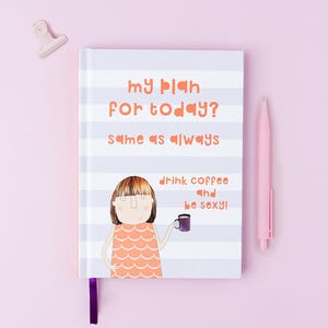 May include: A hardback notebook with light purple and white horizontal stripes. The cover features the text "my plan for today? same as always" and "drink coffee and be sexy!" alongside an illustration of a person holding a purple mug.