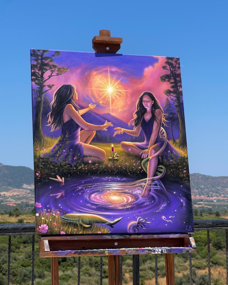 May include: An original painting on an easel depicts two figures in purple dresses, seated in a garden with a swirling galaxy and a bright star. The artwork features a whale, flowers, and a candle, set against a purple and blue sky.